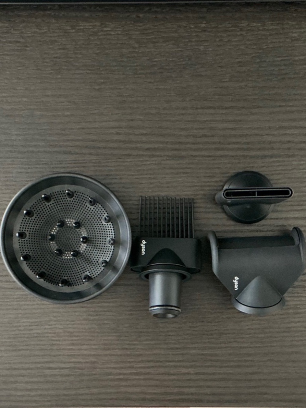 Four Dyson hair dryer attachments